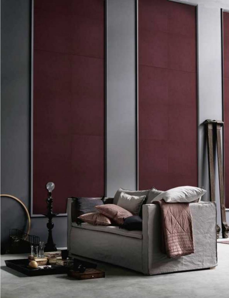 Pure Mosaic in purple with rectangular patterns on a wall.
