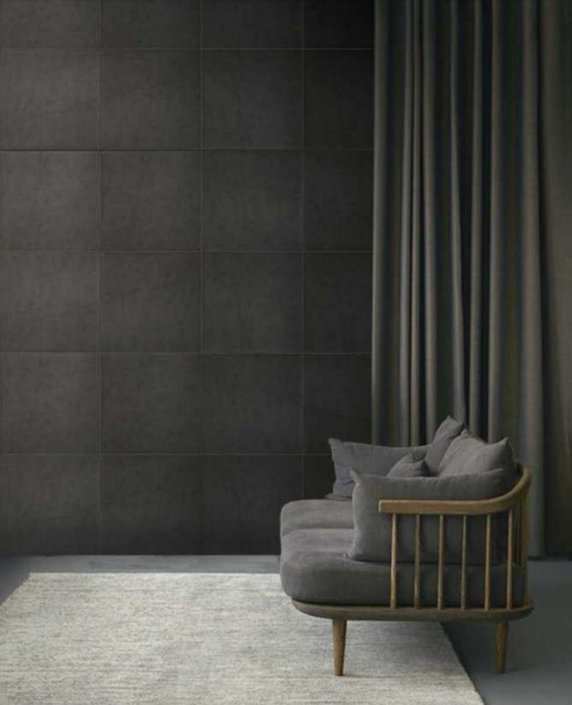Pure Mosaic in black with sqaure patterns on a wall.