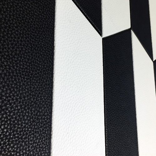Sense mosaic in white and black tones with a polygonal pattern.