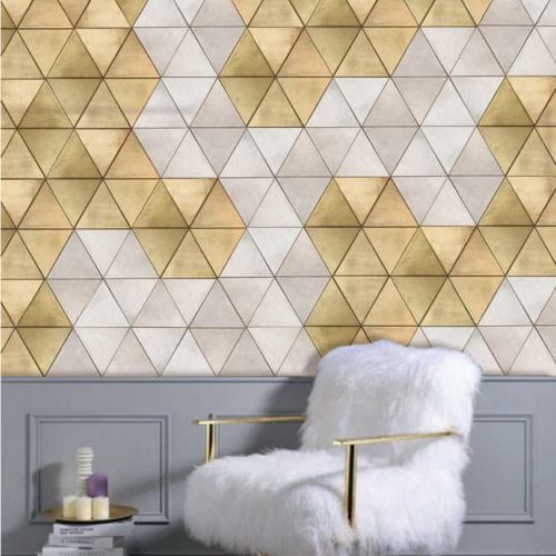 Trinity mosaic in yellow and white with a triangular pattern, set against a wall.