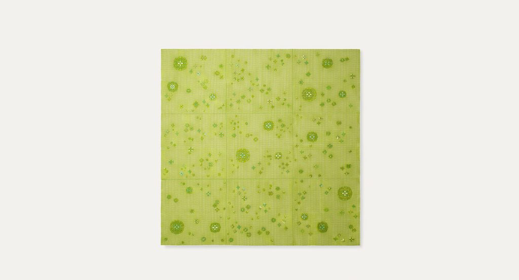 Spring Modular Rug with embroidered floral pattern in green on a white background.