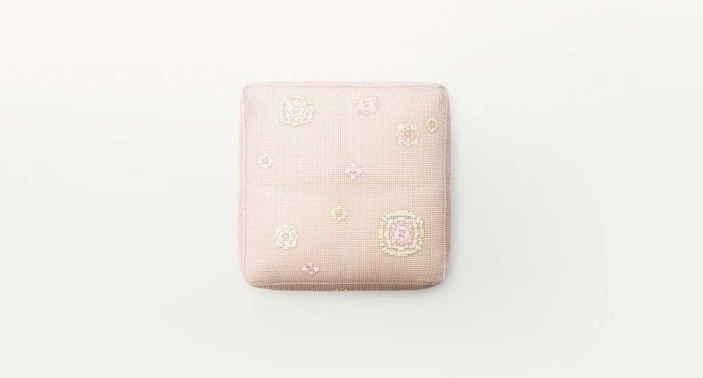 Square Spring Pouf in pink Kimia fabric embroidered upholstery on a white background.