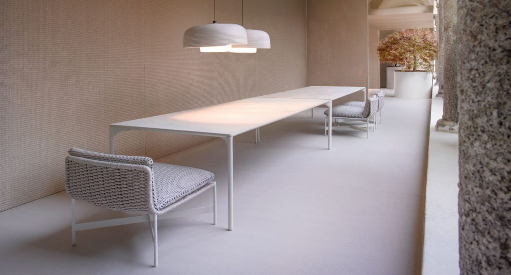 Two white Teiki suspension lamps made by sewing Rope Corda in a dining room.