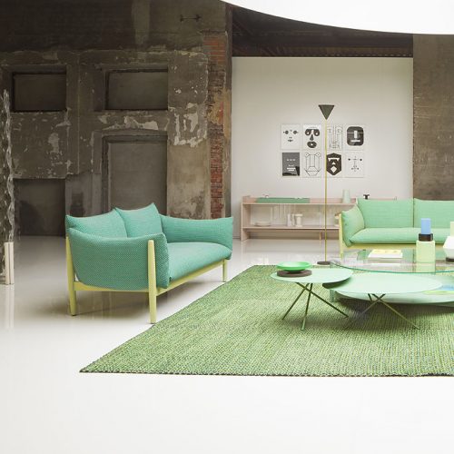 Square Tweed rug by joining large square elements with a polyester yarn in a living room.