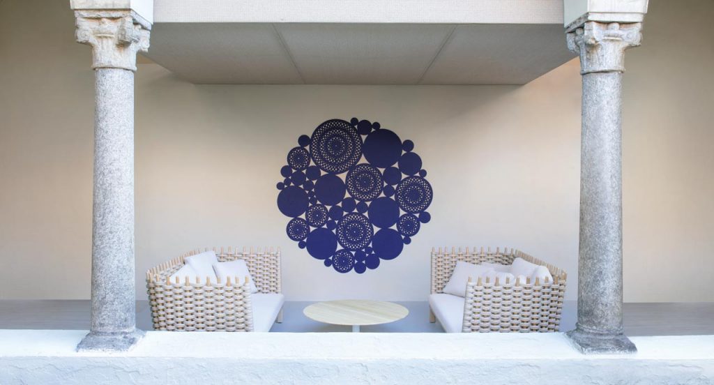 Two Wavi sofas, structural melange weave and wood in natural color, white seat cushion in a living room.