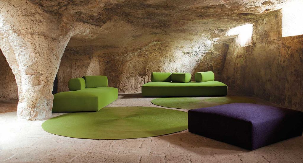 Green Zoe High Tech rug wool cord spiral module in a living room.