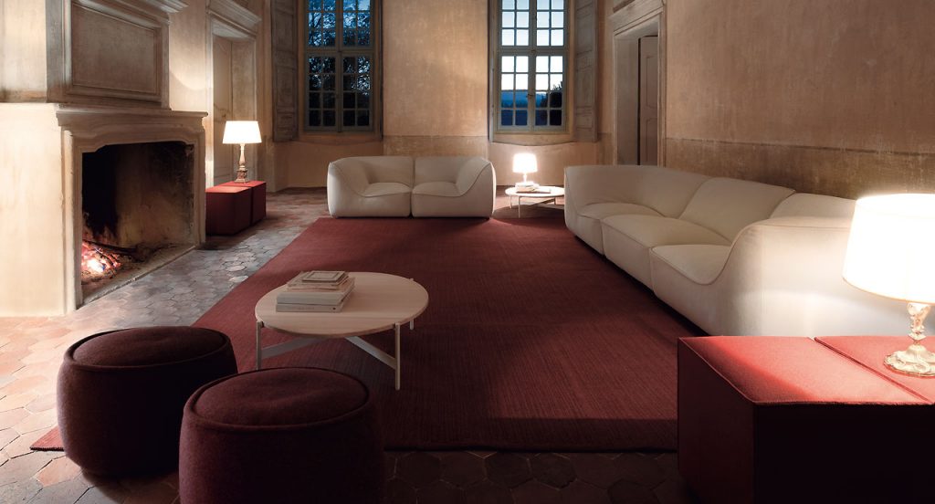 Two white So Sofas, one for three seater, one for two seater, fabrics upholstery, wood base in a living room.