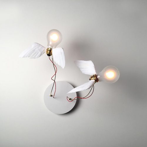 Lucellino Doppio illuminated on a white wall