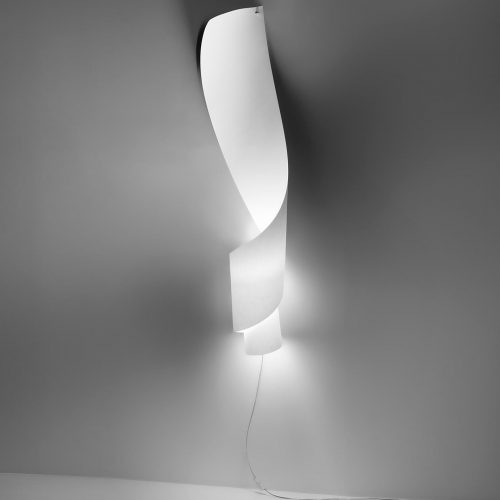 Oop's light in white on a grey wall illuminated