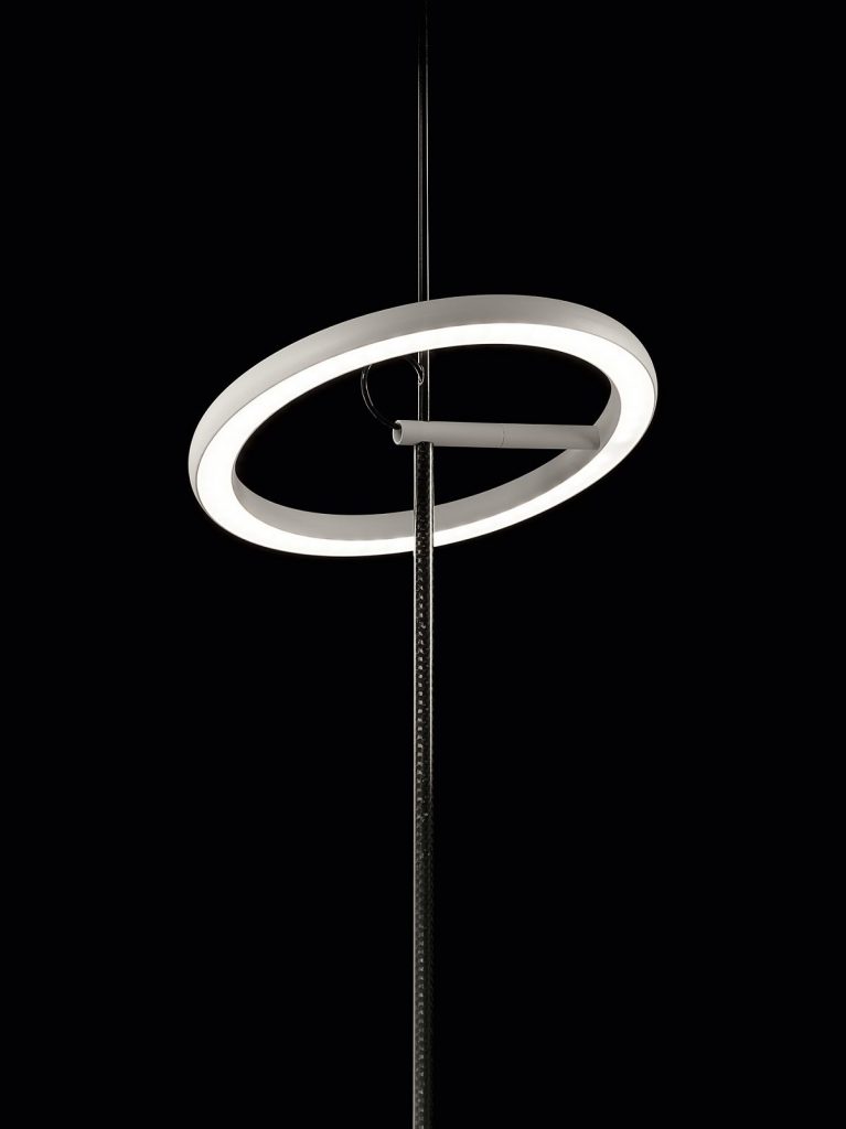 A Ringelpietz standing in front of a black background not illuminated