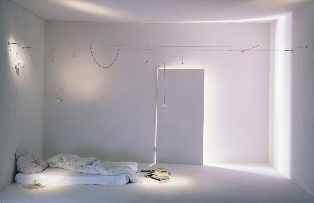 Yayaho hanging in a white room with a door open