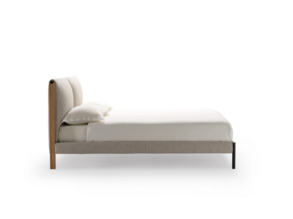 Independent side bed made of oak wood base upholstered in gray polyurethane on a white background