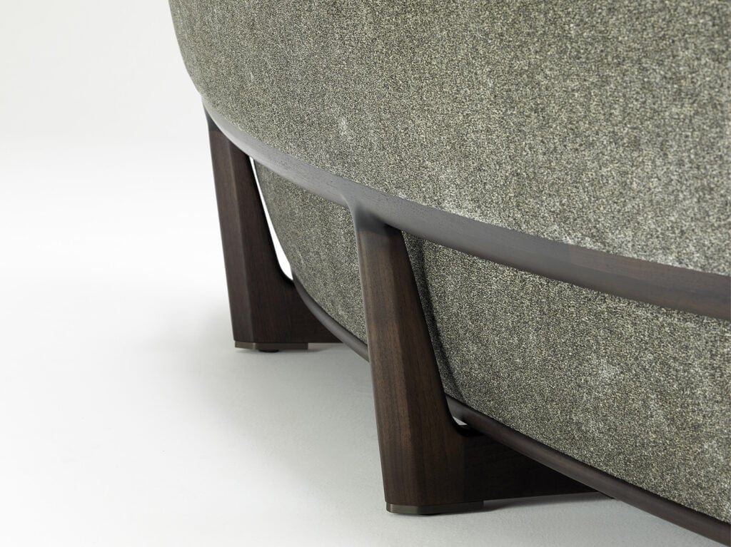 cushion made of fabric in a gray tone on a solid lacquered wood base on a white background