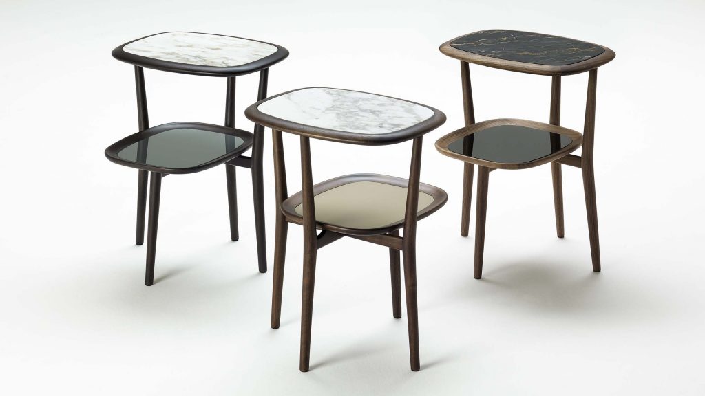 Three smalls two-level nightstands made of cirstal wood and marble base in a white, black, yellow, green and blue tone