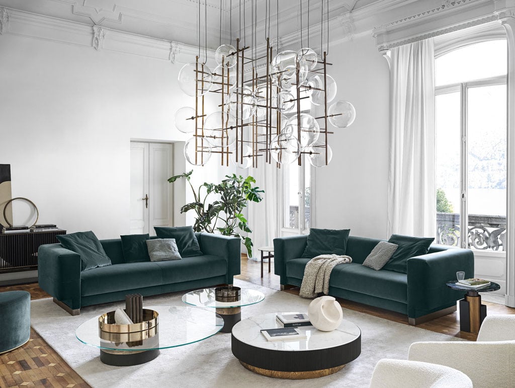 Two Sofa with internal wooden structure upholstered in fabric or leather of a dark blue tone in a living room