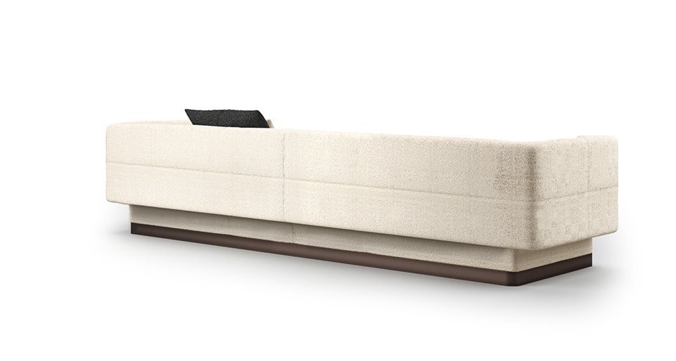 Sofa with internal wooden structure upholstered in fabric or leather of a white tone on a white background