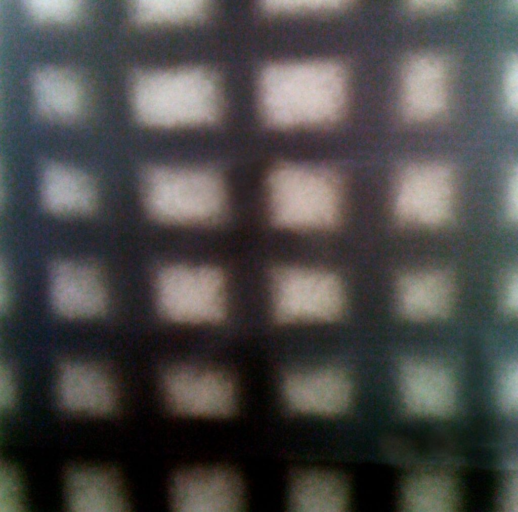 Carbon panel in shades of brown and beige with checkered design