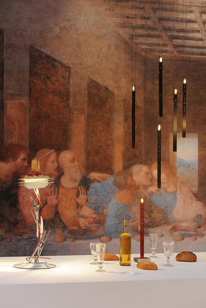 A painting of a group of people behind a table with black colored Flying Flames hanging over the table