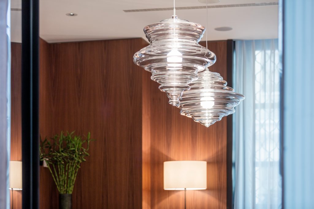 two lamps made from bohemian blown glass in the shape of a thick drop in a transparent color tone