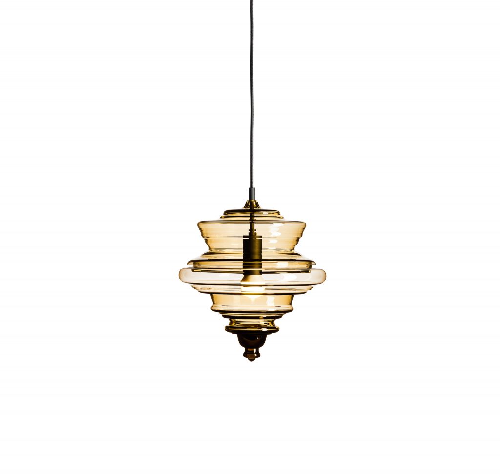small ceiling lamp made from blown glass in a transparent color tone with golden finishies on a white background