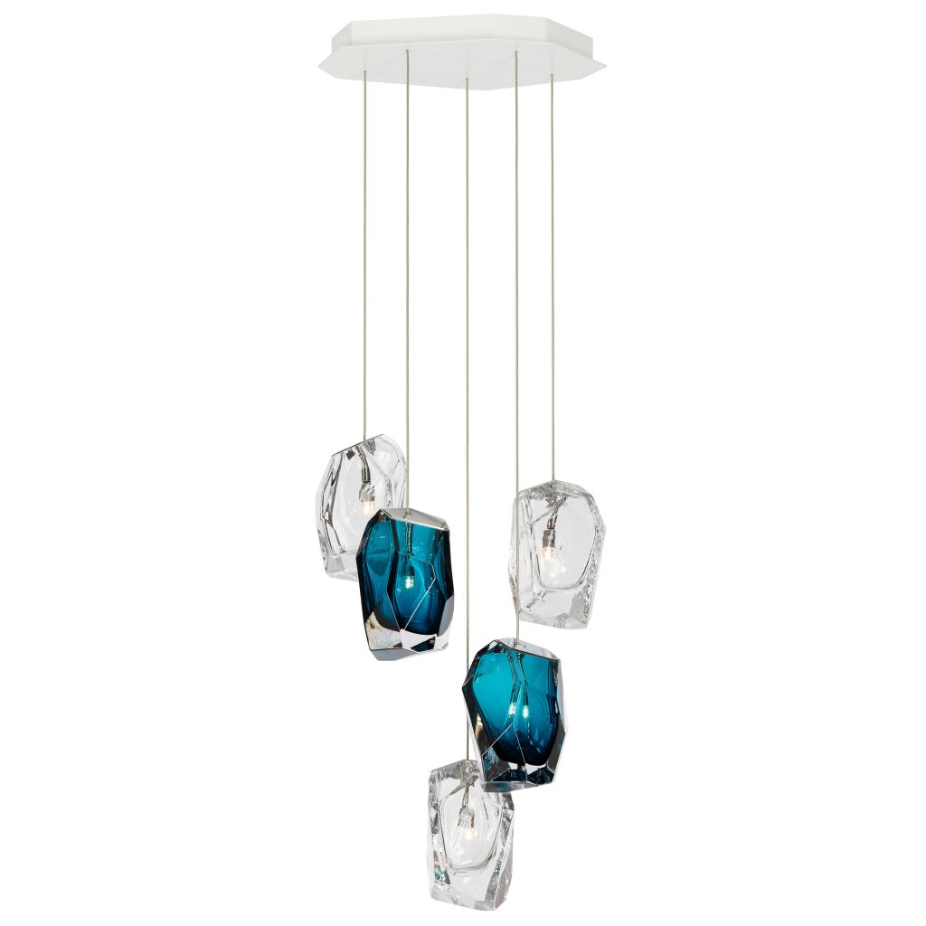 small lamp made of several cirstal stones in shades of blue and white on a white background