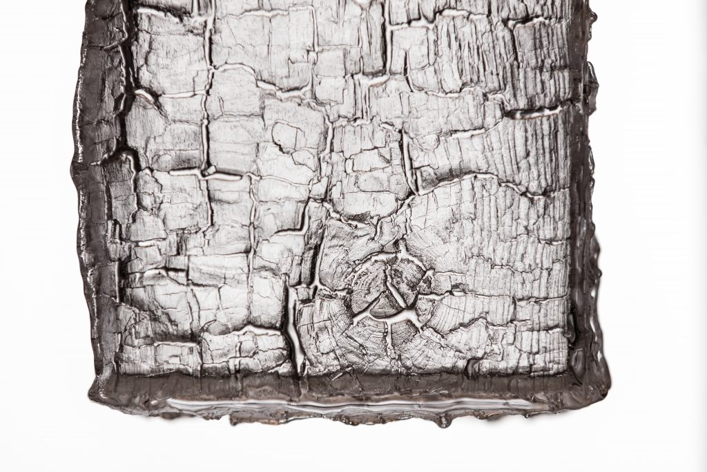 made of natural material with preserved wood in a brown tone sculpture on a white background