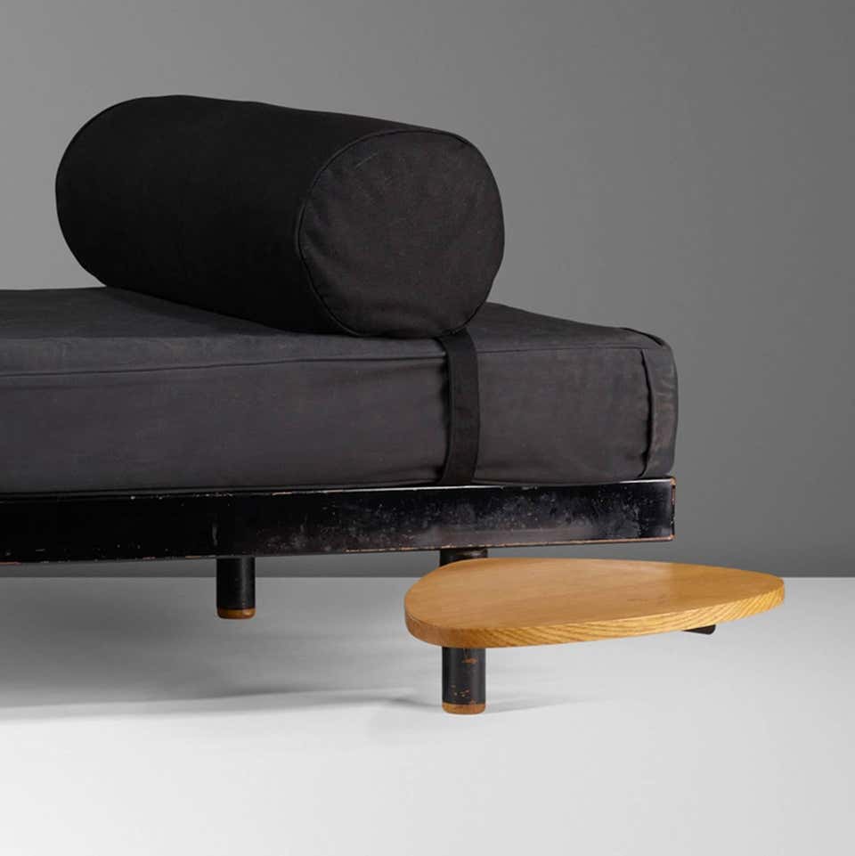 sofa made of fabric base in a black and gray color tone base made of metal wood with an auxiliary table