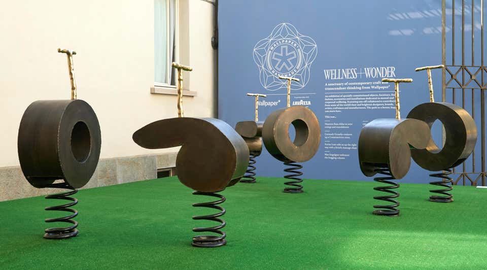 six sculptures for a playground made of wood and rollers in a brown tone in a green area