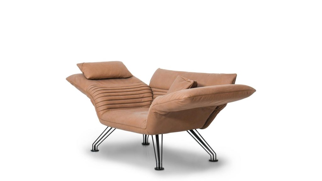 Multifunctional chaise made of aluminum base and upholstered in brick-colored leather on a white background
