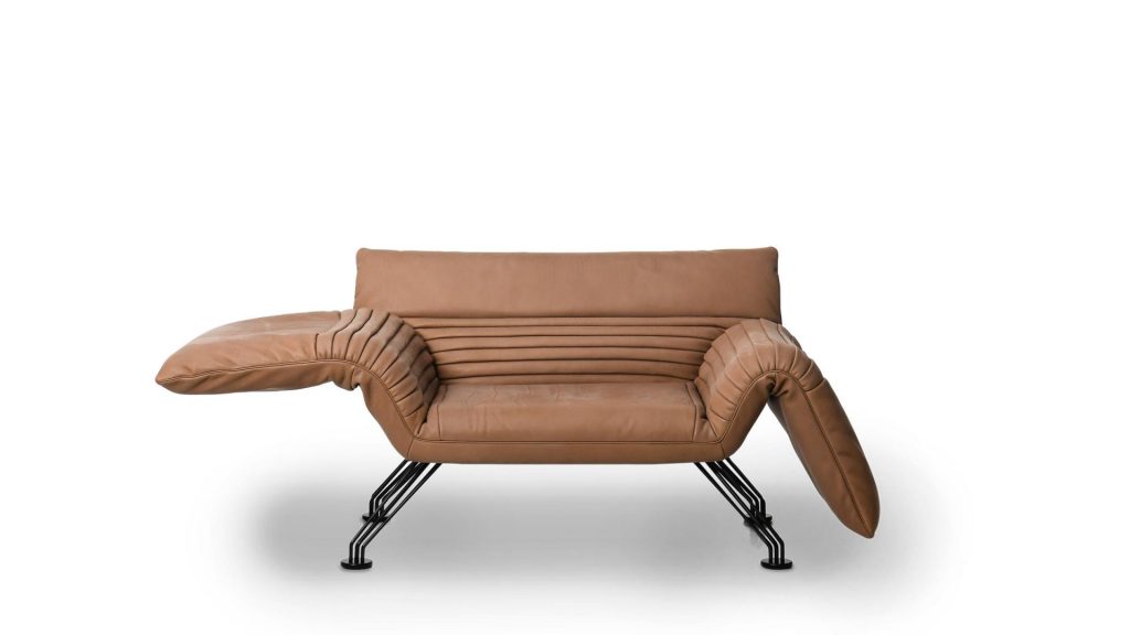 Multifunctional chaise made of aluminum base and upholstered in brick-colored leather on a white background