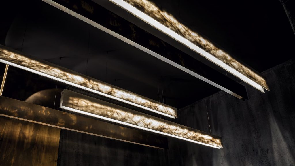 three LED lamps made on a steel base and white crystal stone in black tones with gold finishes