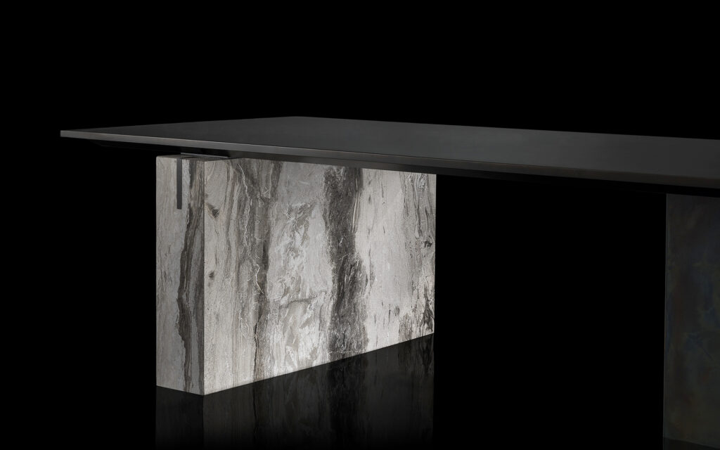 table made of black painted steel base and 20cm top in titanium stone in a gray tone on a black background