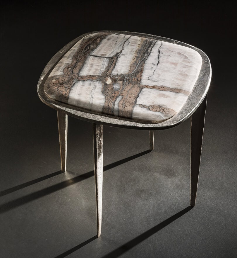 stool made of cast brass base and top set in white stone