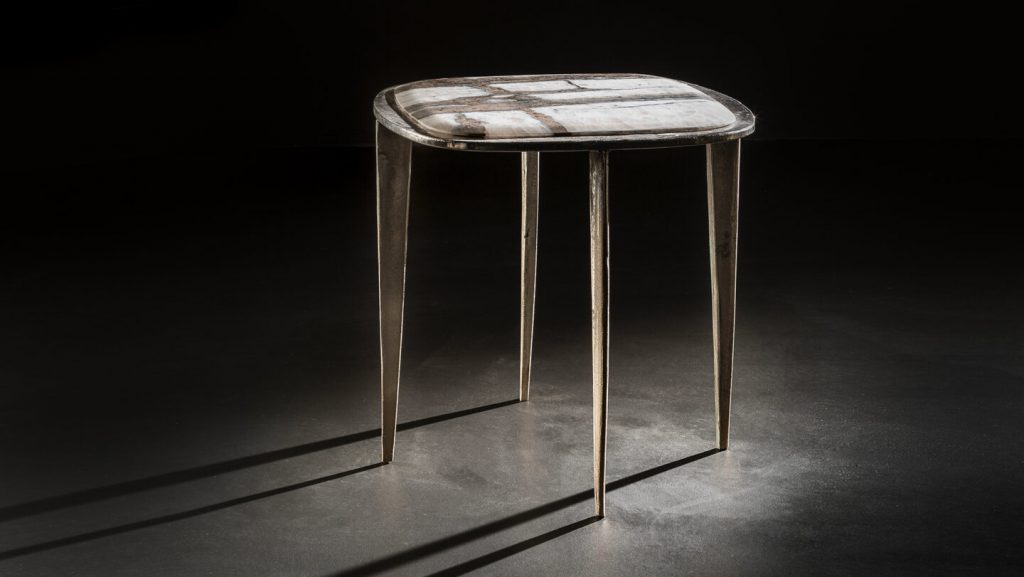 stool made of cast brass base and top set in white stone