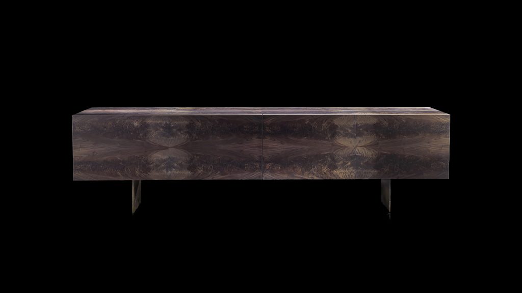 sideboard made of brass and stone in a brown tone on a black background