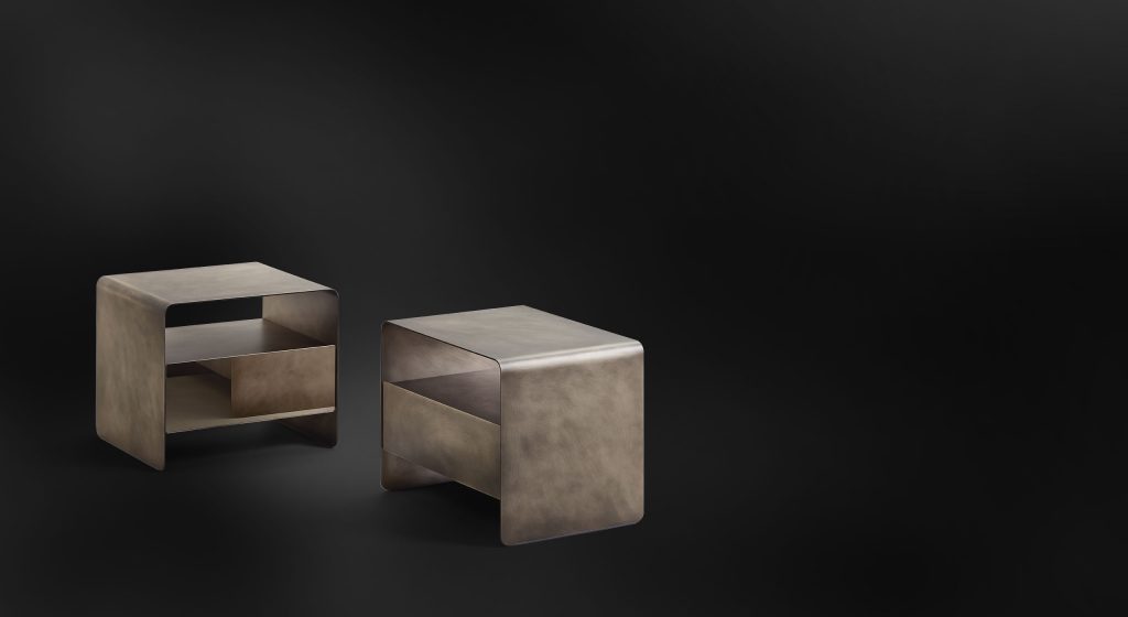 Two nightstands made of gold-tone brass base on a white background