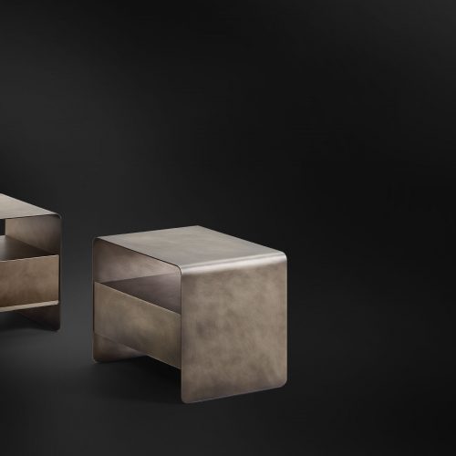 Two nightstands made of gold-tone brass base on a white background