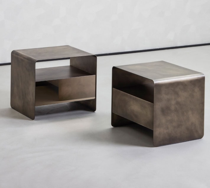 Two nightstands made of gold-tone brass base on a blackground
