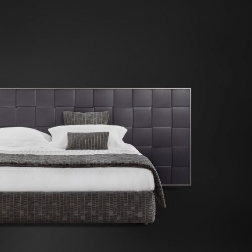 bed with large backrest engraved in macro woven wood pattern and upholstered in black leather