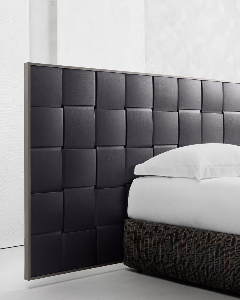 bed backrest made of wooden fabrics macro in leather of a black color tone on a white background