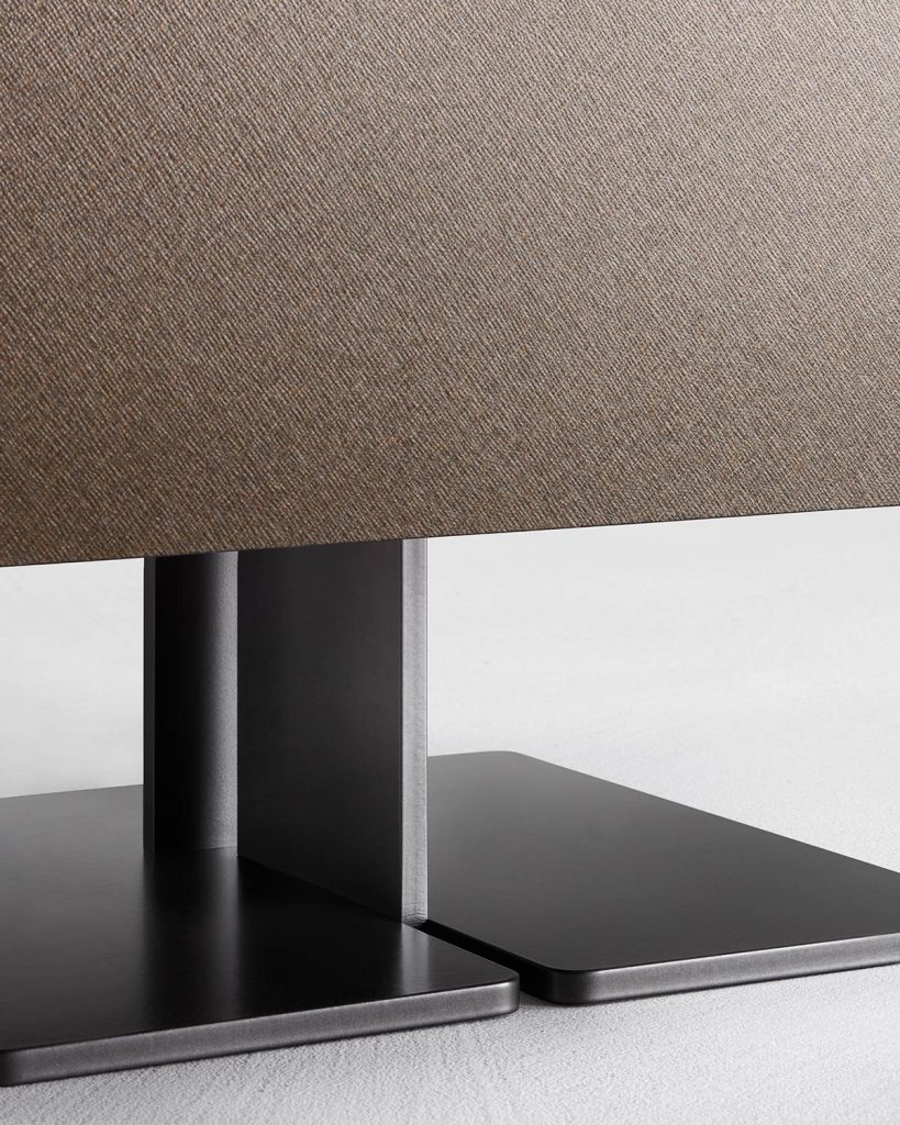 nightstand with central curved metal foot and drawers made of lacquered wood in a brwon tone