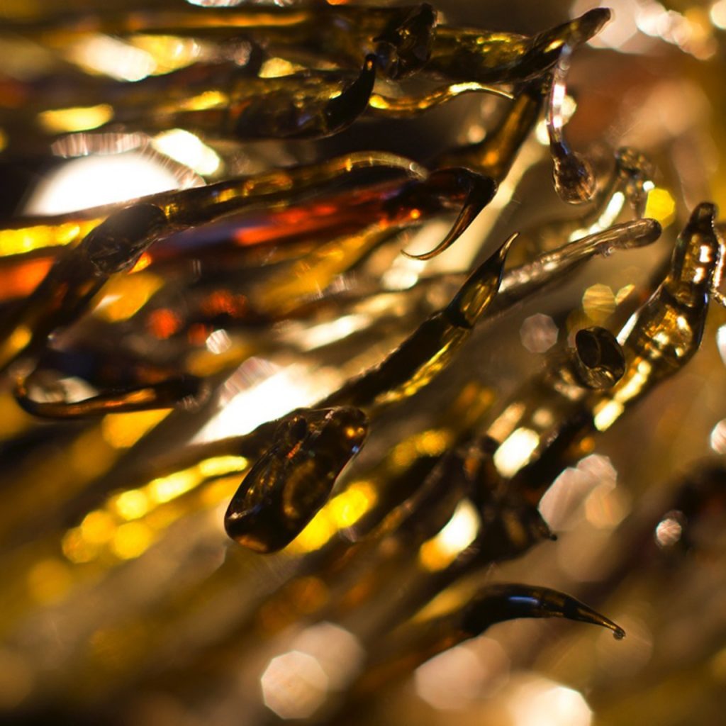 methacrylate threads heated to volcanic temperatures in golden tones