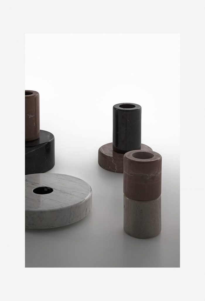 four stone and marble bases in a brown and gray tone on a white background
