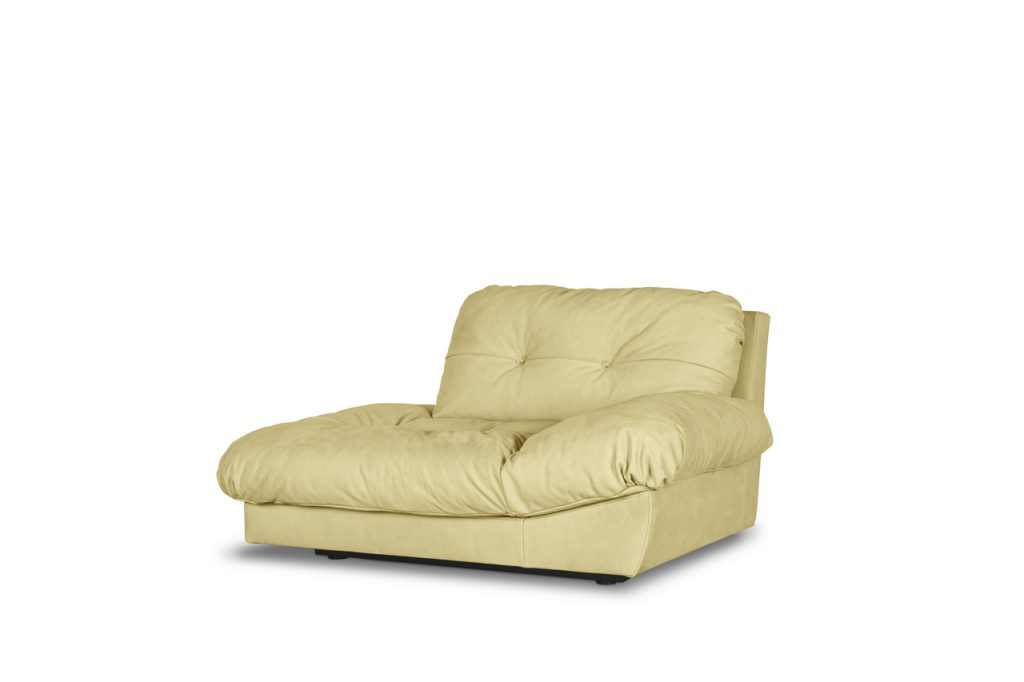 padded armchair made of leather in a yellow tone on a white background
