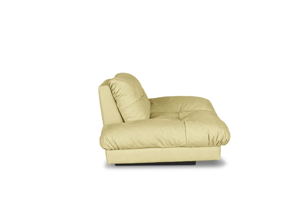 padded armchair made of leather in a yellow tone on a white background