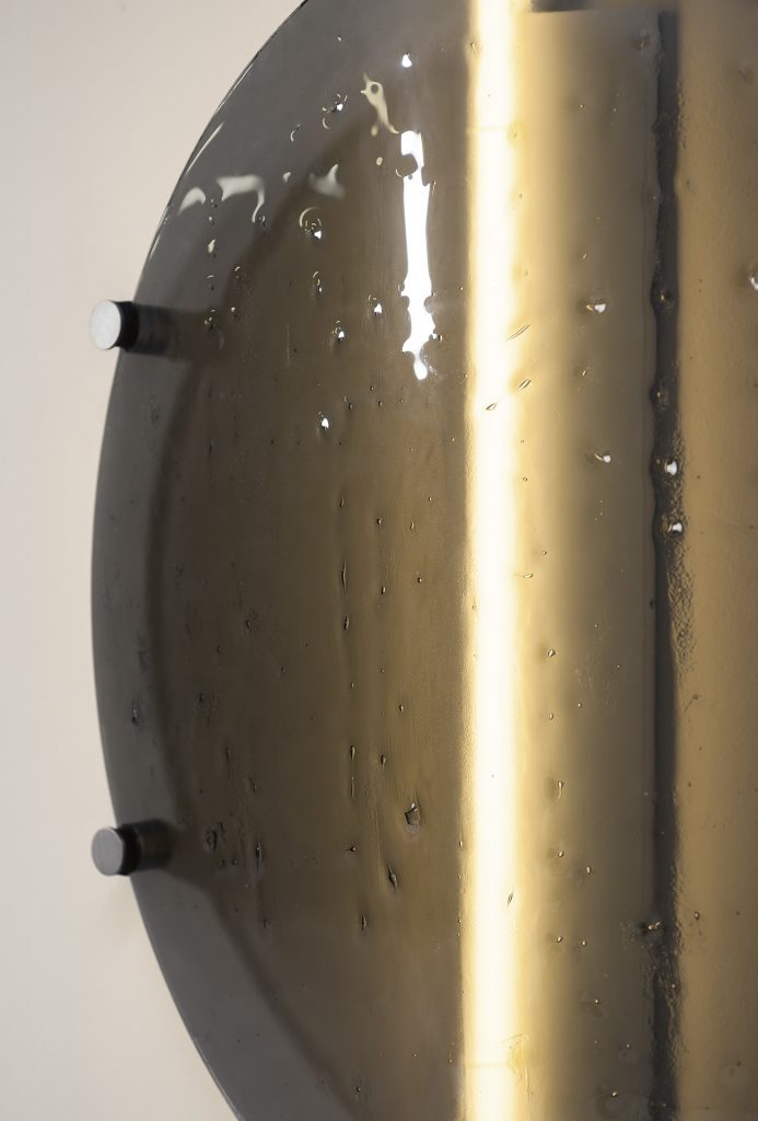 made of glass and brass dish-shaped wall lamp in a bronze color tone