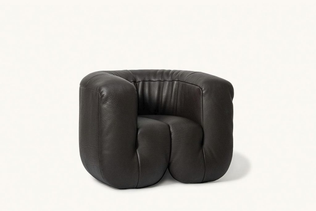 armchair made of leather in a black tone on a white background