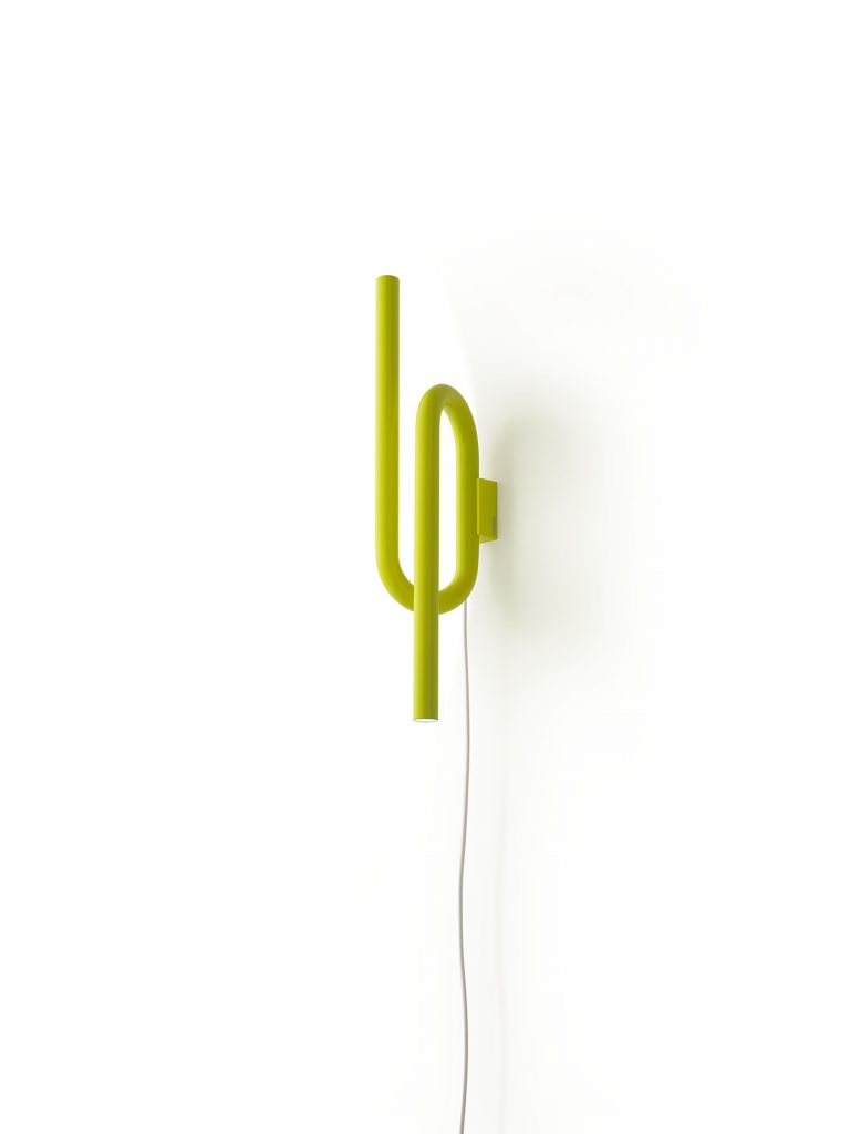 wall lamp emits symmetrical light in a green tone on a white background