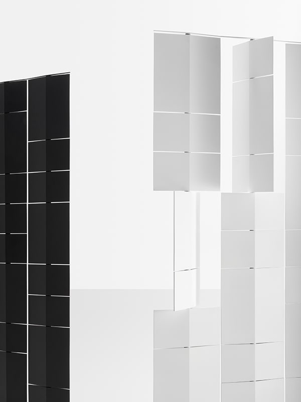 two 360 degree rotating glass amniote dividers in a white and black color tone on a white background