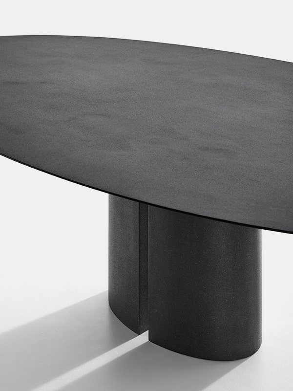 table made of rebuilt black ebony with opening in the middle of the base on a white background